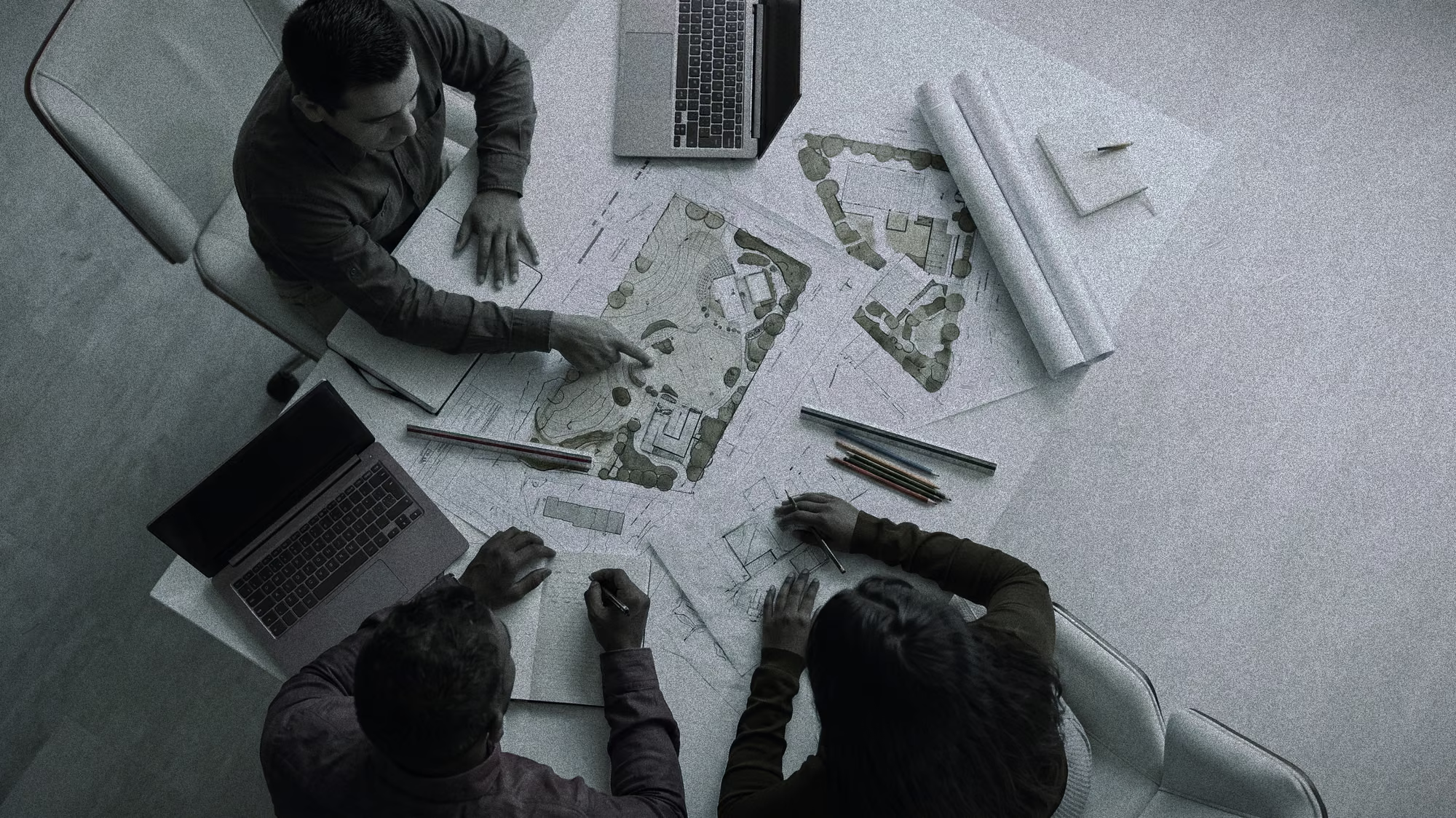 Terraform designers working over a site plan